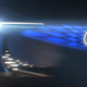 Teaser image of an electric Acura concept with blue light-up grille and badge.